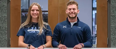 Jack Day and Norah Perkins smile at the camera.